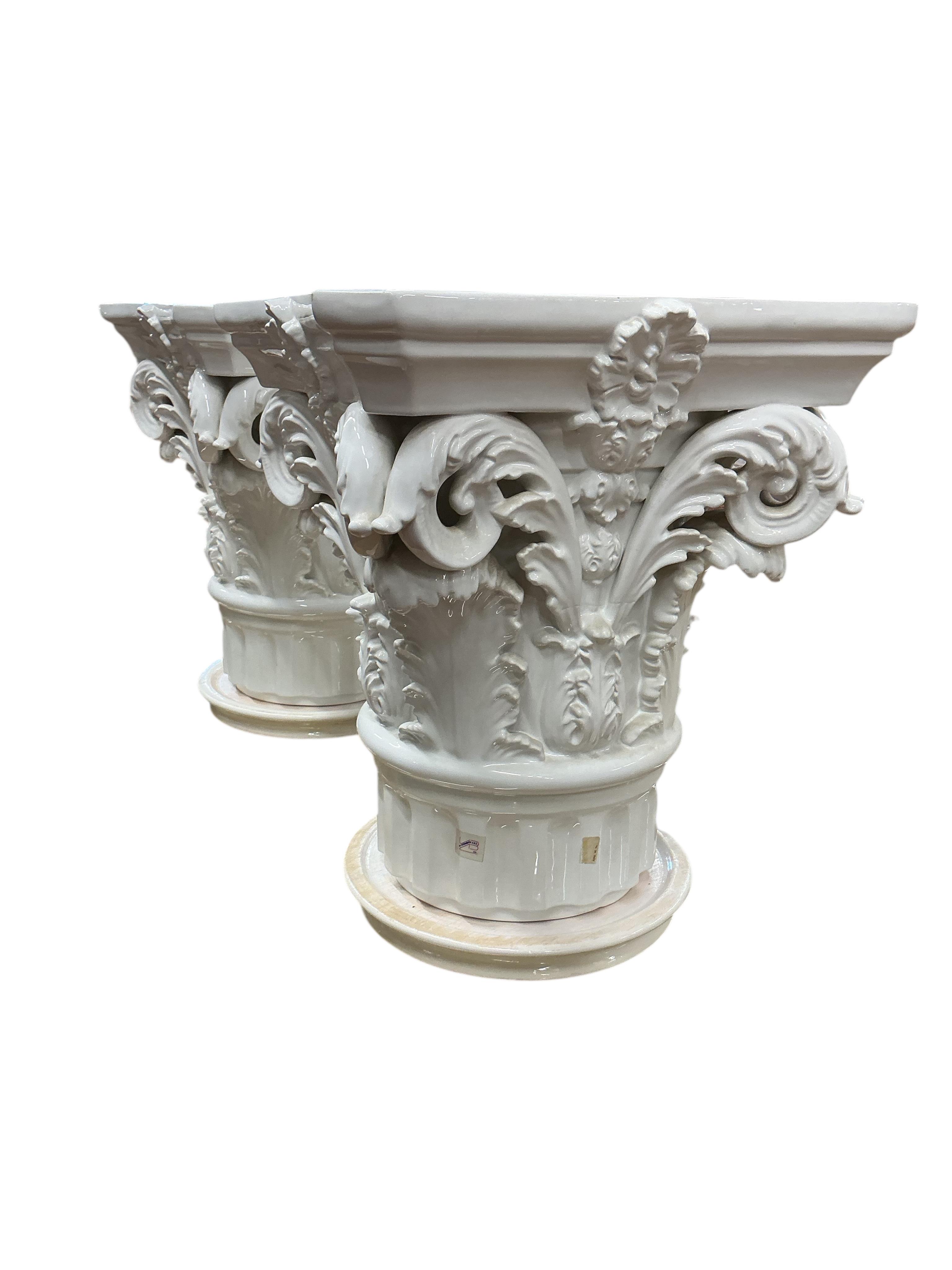 A pair of Italian VBC Ceramica Corinthian column capital pedestals, height 47cm